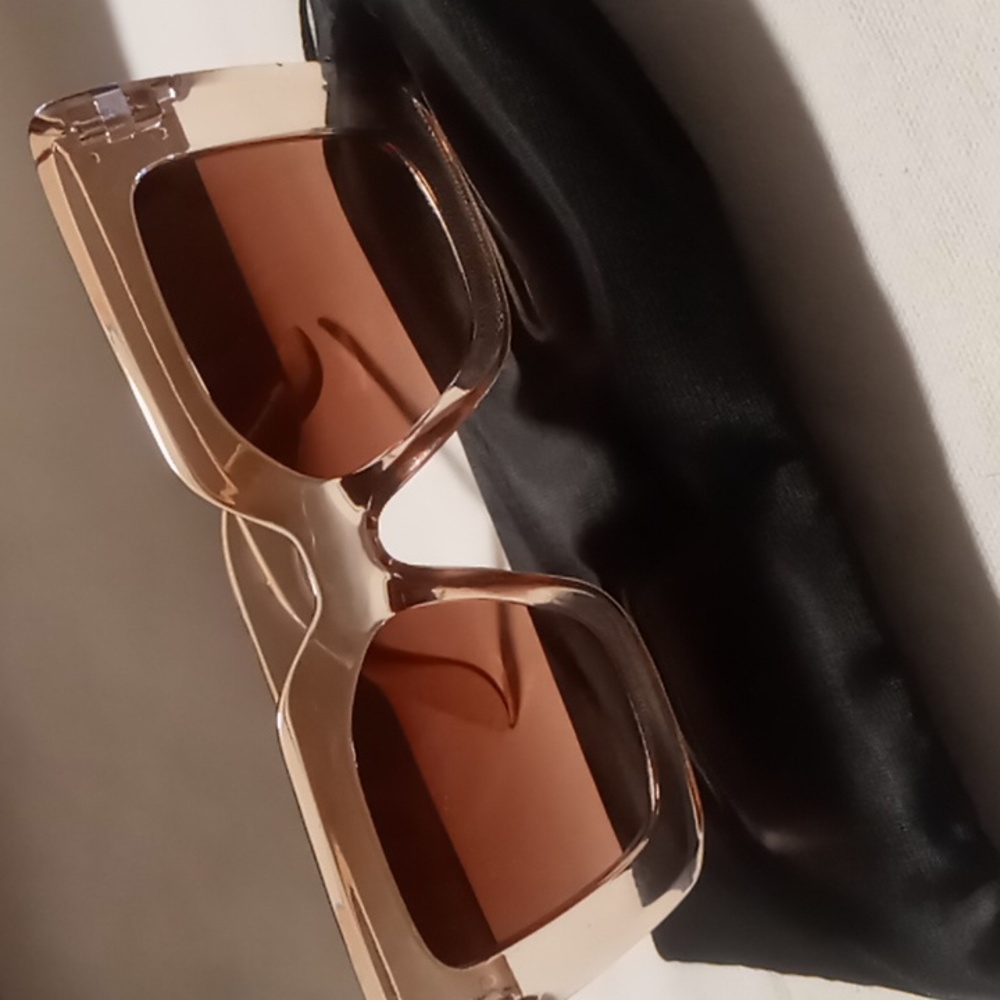 Wide frame lens sun glasses Translucent tan with a lens perfect for driving.
